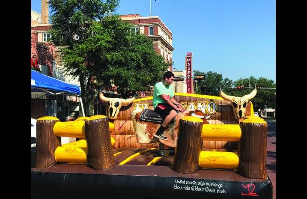 Ride at your own risk! Bull riding just one of many entertainments at St. Francis Xavier Fall Festival