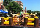 Ride at your own risk! Bull riding just one of many entertainments at St. Francis Xavier Fall Festival