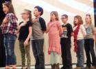 Third Graders salute the flag as they sing “Star Spangled Banner”.