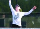 Abby Geye gets tall to return a volley at the net at the Region tourney for her Lady Wildcat doubles’ team.